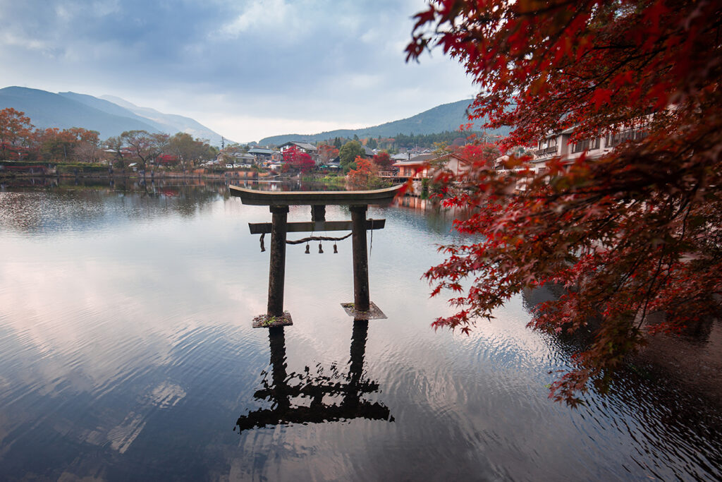 Kinrin lake in Yufuin town , Kyushu region of Japan Yufuin is a popular Onsen resort in Kyushu, Japan. small lake with clear water from a hot spring, Morning Mist at lake.